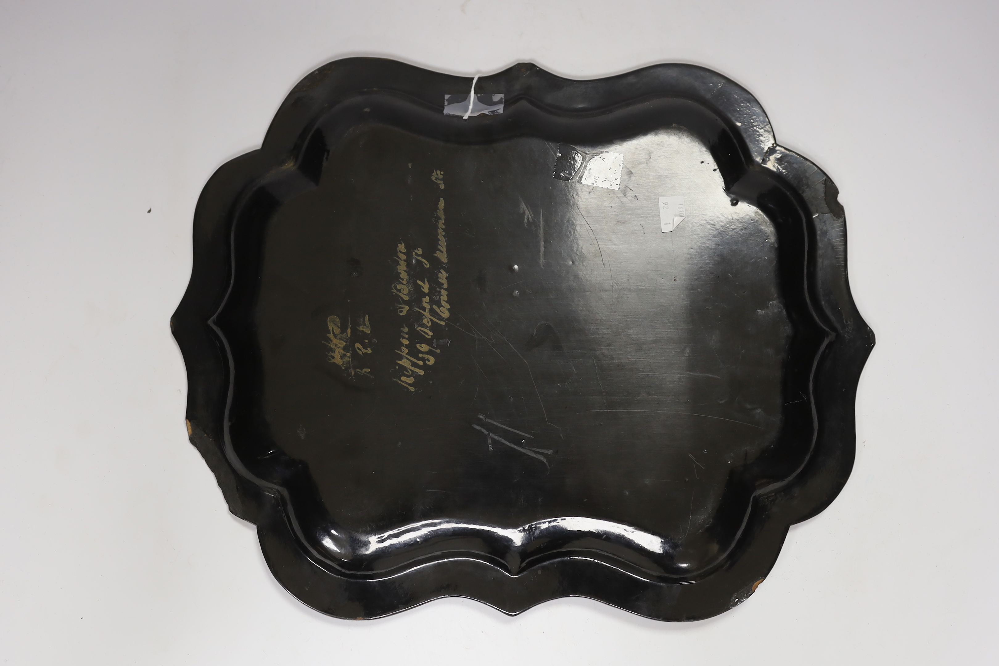 An oval 19th century papier maché gilt decorated tray, with hand painted figural cartouche, 46cm wide